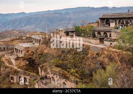 Layers of cave dwellings dug into the hillside in Lijiashan village, Shanxi Province, China. Stock Photo