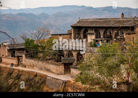 Layers of cave dwellings dug into the hillside in Lijiashan village, Shanxi Province, China. Stock Photo