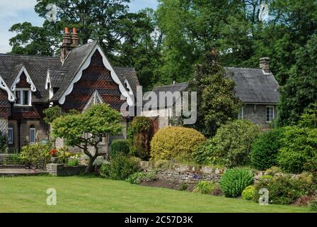 Pretty house and garden in the estate village of Ilam, Staffordshire, UK; many of the houses are built in the Swiss Chalet style. Stock Photo