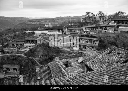 Layers of cave dwellings dug into the hillside in Lijiashan village, Shanxi Province, China. Stock Photo