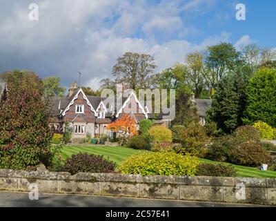 Pretty house and garden in the estate village of Ilam, Staffordshire, UK; many of the houses are built in the Swiss Chalet style. Stock Photo