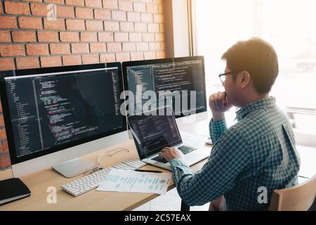 Developing programming and coding technology working in a software develop company office. Stock Photo