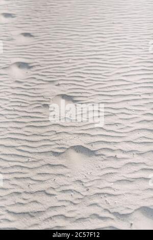 Footsteps in the sand—a romantic evening stroll along the beach (beachfront, Salalah, Oman) Stock Photo