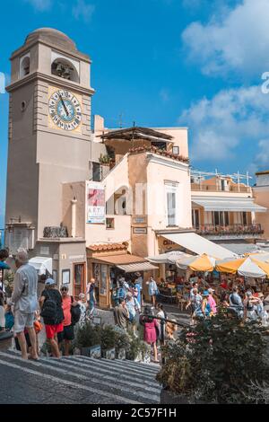 Capri, Italy - August 13, 2019: Tourists in city center square in hustling summer morning Stock Photo
