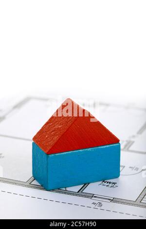 house made of two toy blocks on blueprint of floor plan Stock Photo