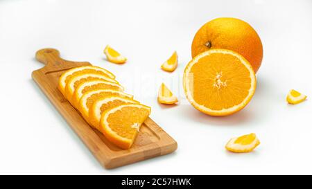 Bright, juicy, sweet oranges on the white background. Stock Photo
