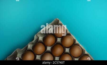A box of eggs on a blue background Stock Photo