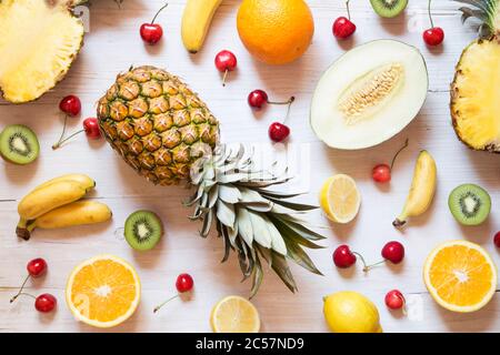 Tropical fruit on white wooden background Stock Photo