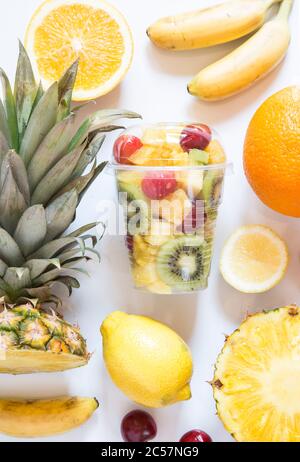 Tropical fruit cocktail in white background Stock Photo