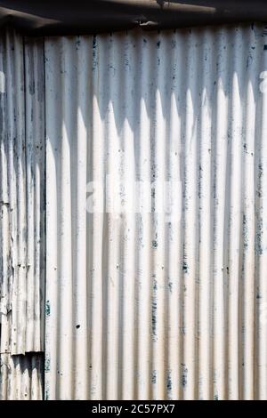 White painted wave metal sheet wall texture background Stock Photo