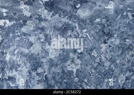 Background with uneven putty and paint. Interesting texture for the background. Uneven smears of putty and paint on the wall. Stock Photo