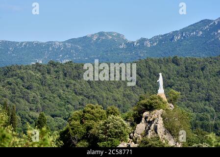 Statue of La Vierge du Rocher or Virgin Mary of the Rock Looking over the Var or Mediterranean Forest Tourves Var Provence France Stock Photo