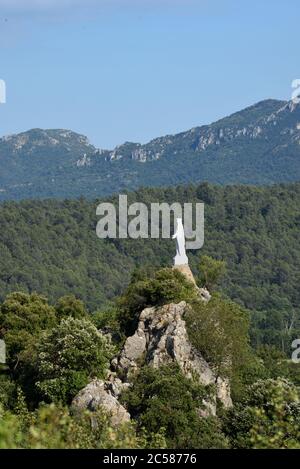 Statue of La Vierge du Rocher or Virgin Mary of the Rock Looking over the Var or Mediterranean Forest Tourves Var Provence France Stock Photo