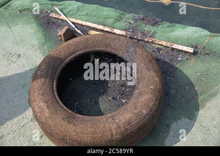 Sea Pollution, waste materials metal, plastic, rubber, industrial wastes thrown inside sea Stock Photo