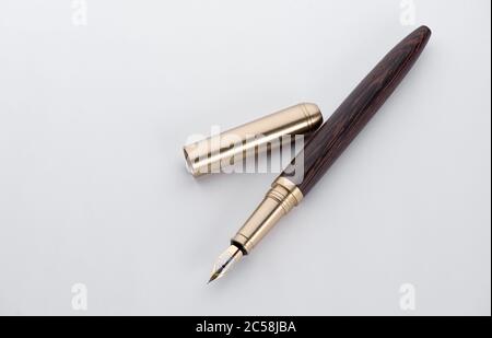 Fountain writing pen on a white paper sheet Stock Photo