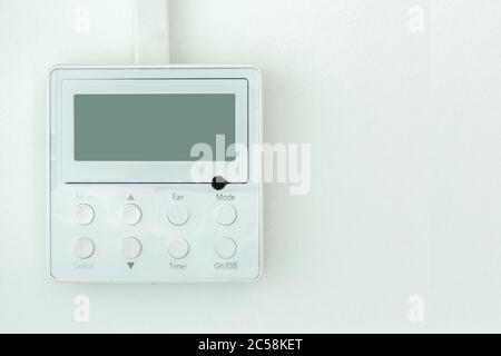 white wall air conditioning control panel with screen and control buttons with copy space close up. Stock Photo
