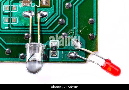 Electronic board with diodes. Solder electronic components. Part of the deal. Integrated circuits and diodes. Stock Photo