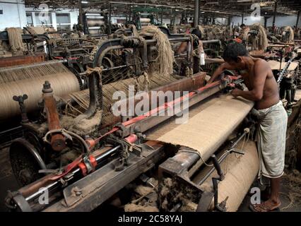 DHAKA, BANGLADESH - 01JULY 2020:  Workers busy in making jute sacks at jute processing mill in Narayanganj near Dhaka,. Jute Industry in Bangladesh is an industry that is historically and culturally important that once was the biggest industry in the region. Stock Photo