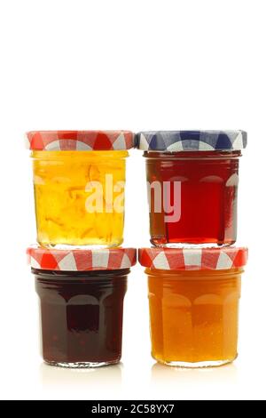 glass jars with assorted  jam and marmalade with room for your label, text or images on a white background Stock Photo