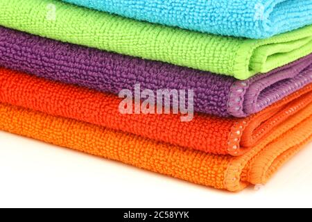 stacked colorful microfiber cleaning cloths on a white background Stock Photo