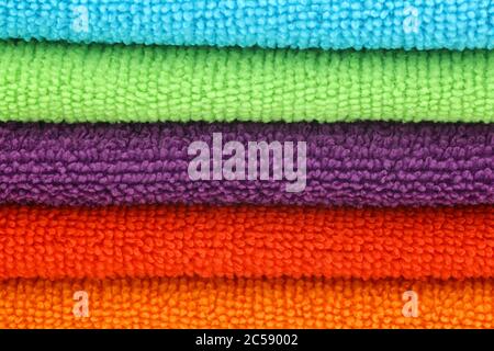 stacked colorful microfiber cleaning cloths background Stock Photo