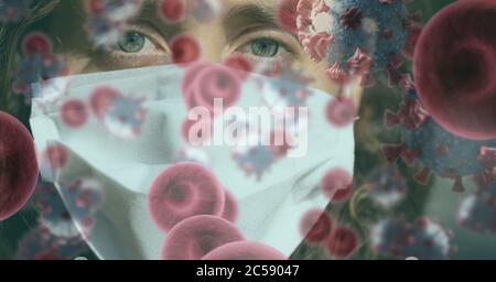Covid-19 cells against woman wearing face mask Stock Photo