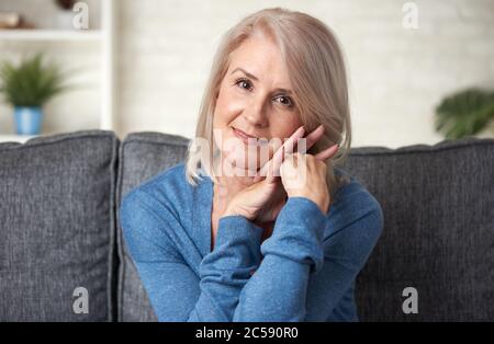 Portrait of an attractive elegant senior woman relaxing at home Stock Photo