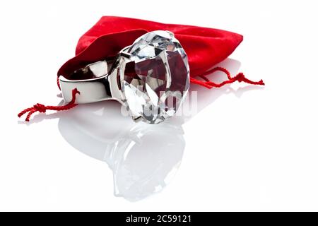 fashion jewelery ring and red velvet pouch isolated on white Stock Photo