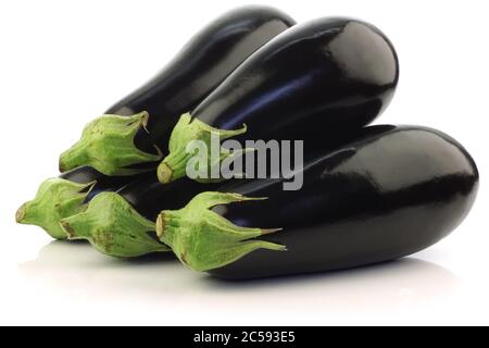 fresh aubergines on a white background Stock Photo
