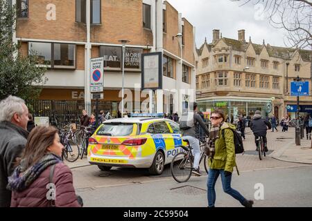 Police emergency response vehicle seen parked near a busy Saturday shopping area in the town centre. Stock Photo
