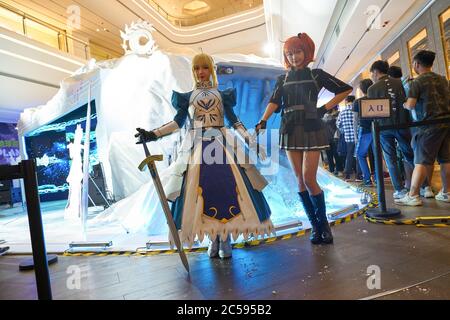SHENZHEN, CHINA - APRIL 20, 2019: cosplay of the Fate/Grand Order 'Saber' and 'Ritsuka Fujimaru' characters at Sony Expo 2019 in Shenzhen, China. Stock Photo