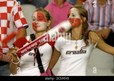 Split, Croatia - 17 August, 2005: Two fiery cheerleaders in the stands during the friendly football game Croatia - Brazil in split 2005 Stock Photo