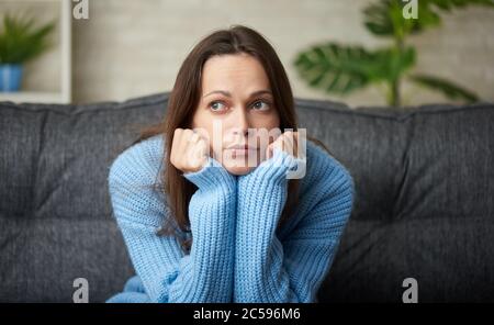 Lonely sad woman deep in thoughts. Portrait of a thinking woman Stock Photo