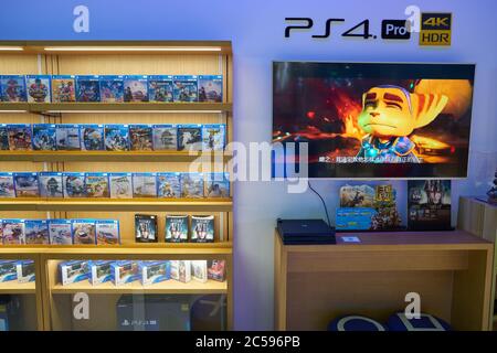 Store display filled with PlayStation 4 games for a home video game console  Stock Photo - Alamy