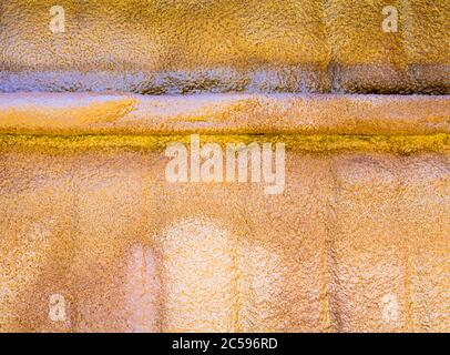 Foam injected under the roof sheet as insulation Stock Photo