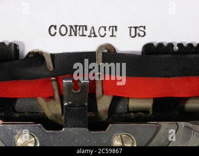 text CONTACT US on the vintage typewriter Stock Photo