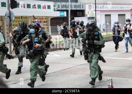 HONG KONG, HONG KONG SAR, CHINA: JULY 1st 2020.Police deal with the illegal protest march by charging and shooting pepper balls.Hong Kong Special Administrative Region Establishment Day. Twenty-three years after Hong Kong was handed by Britain back to Chinese rule, Beijing is pushing to implement tough new national security laws that will suppress the pro-democracy protests seen in the city. It will shatter the Sino-British Joint Declaration where China agreed to the One country, Two systems government. The banning of traditional marches for the first time, has infuriated the public. Alamy Liv