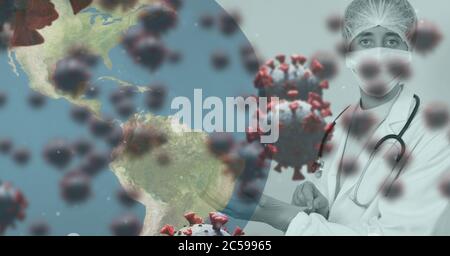 Covid-19 cells and globe against doctor wearing protective gloves Stock Photo