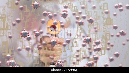 Covid-19 cells against doctor using electronic thermometer Stock Photo