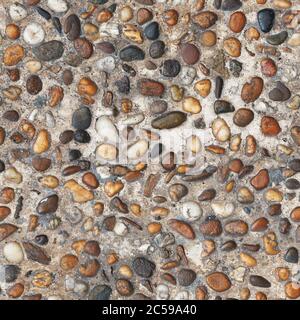 color pebble stones in cement floor. Seamless texture Stock Photo