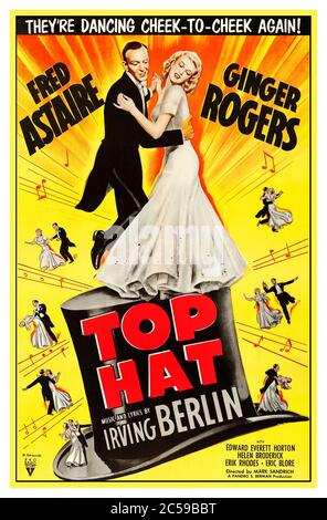 Vintage 1930's Top Hat movie starring Fred Astaire and Ginger Rogers is a 1935 American Irving Berlin musical comedy film in which Fred Astaire plays an American dancer named Jerry Travers, who comes to London to star in a show produced by Horace Hardwick (Edward Everett Horton). He meets and attempts to impress Dale Tremont (Ginger Rogers) to win her affection. The film also features Eric Blore as Hardwick's valet Bates, Erik Rhodes as Alberto Beddini, a fashion designer and rival for Dale's affections, and Helen Broderick as Hardwick's long-suffering wife Madge. Stock Photo