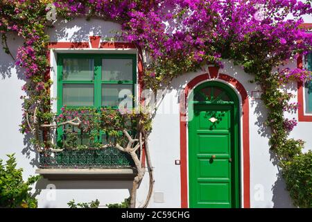 Typical white houses colonia shown in Puerto de Mogan, Spain.  Favorite vacation place for tourists and locals on island Stock Photo