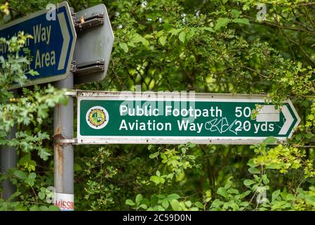 Public bridleway, cycle path and footpath in Southend on Sea, Essex, UK, to Aviation Way and Rochford. Overgrown signpost. Graffiti vandalised Stock Photo