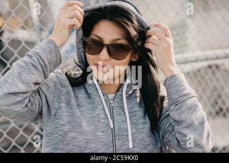portrait of beautiful hispanic woman wearing sportswear Stock Photo