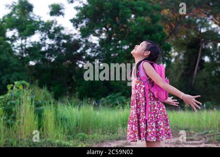 Freedom asian little girl with backpack.Back to school concept Stock Photo