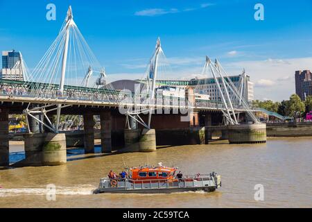 Hungerford bridge across the thames in London, England, United Kingdom Stock Photo