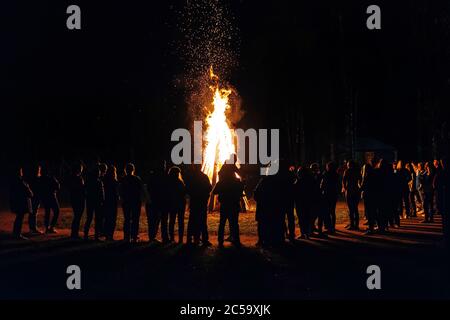 A lot of people have a night fire in the summer Stock Photo