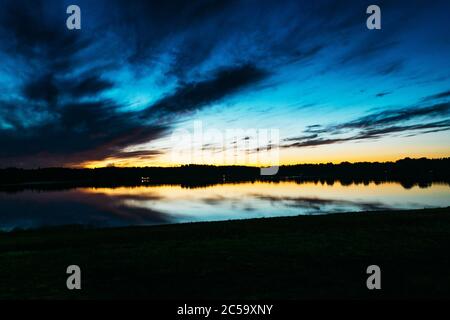 Late sunset on the lake in summer Stock Photo