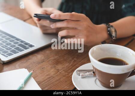 Closeup hand using mobile phone. Using online connect technology for business, education and communication. Stock Photo