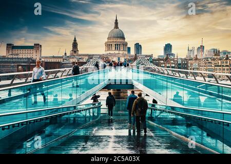 The Millennium Bridge and St Paul Cathedral in London at sunset